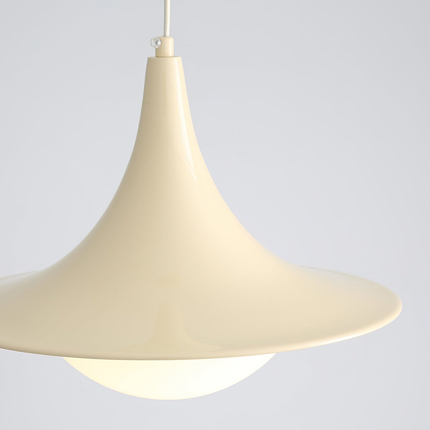 Beige pendant lamp against a light gray background