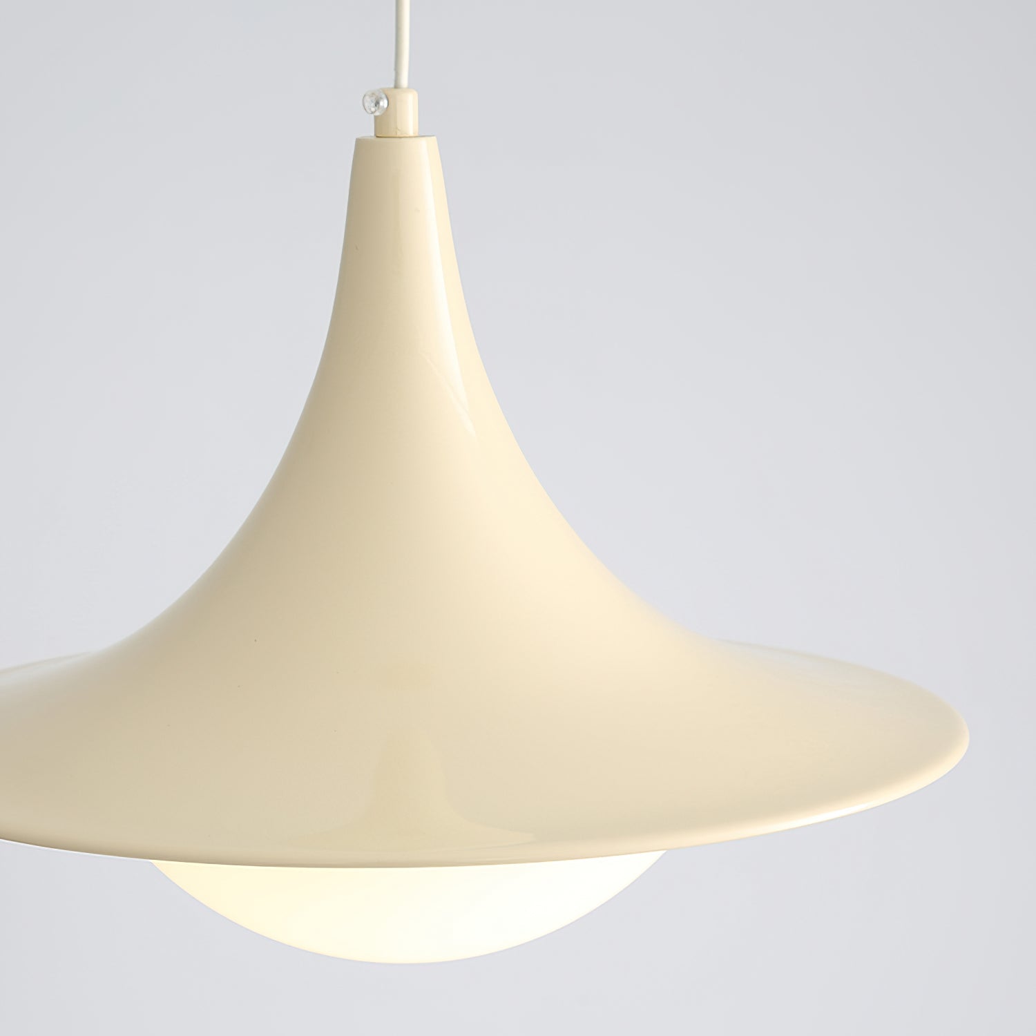 Beige pendant lamp against a light gray background