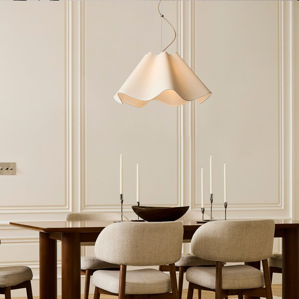Dining room with a wooden table, chairs, and a pendant light.