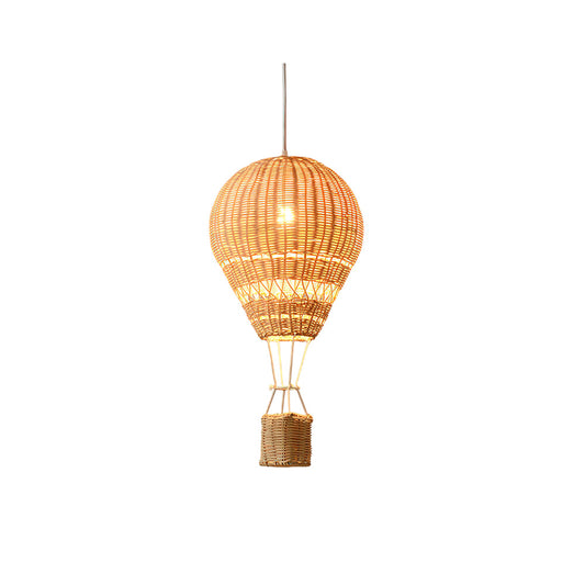 Woven rattan pendant light on a white background