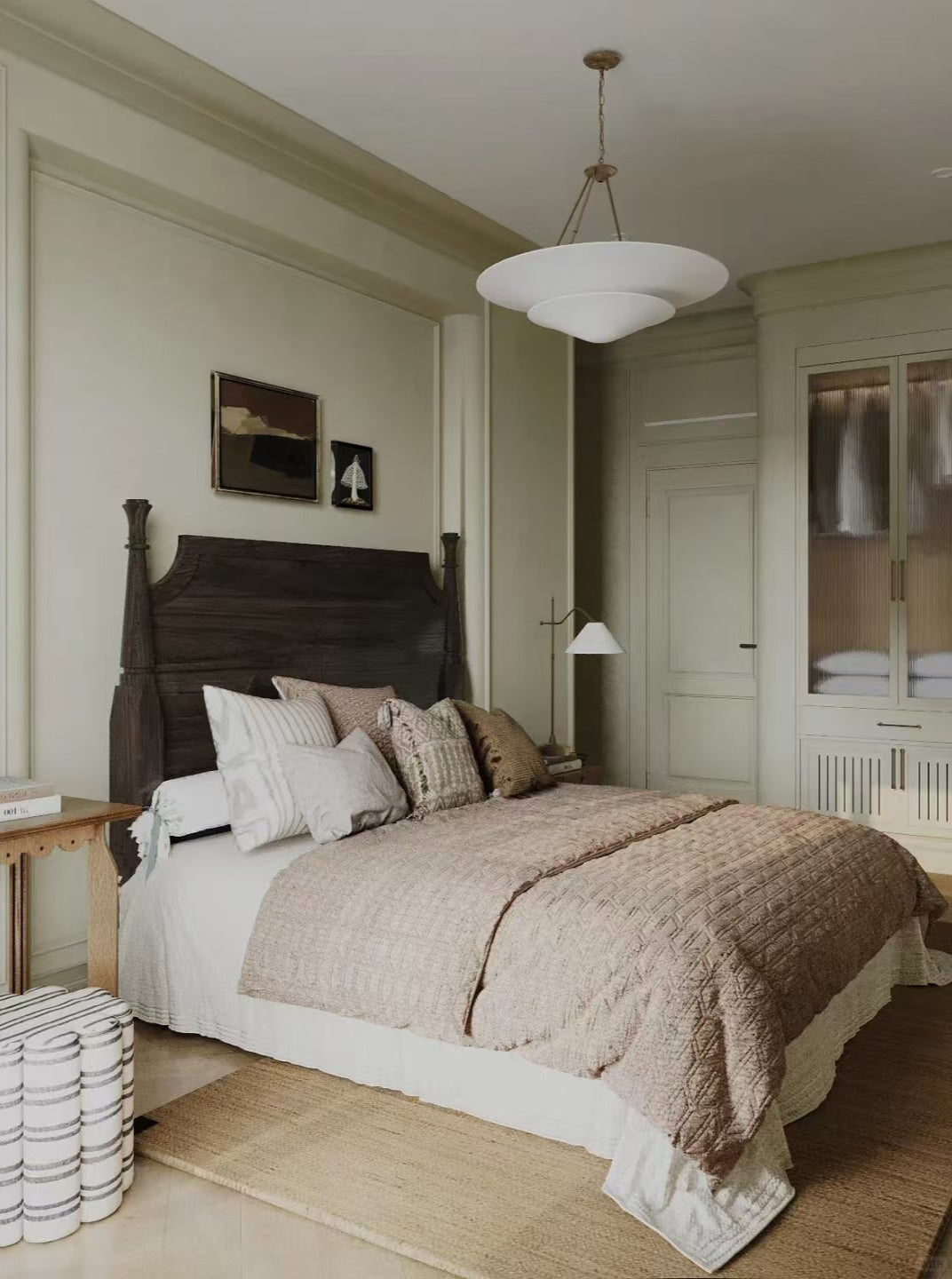Bedroom with a wooden headboard and beige bedding, featuring a lamp and mirror.