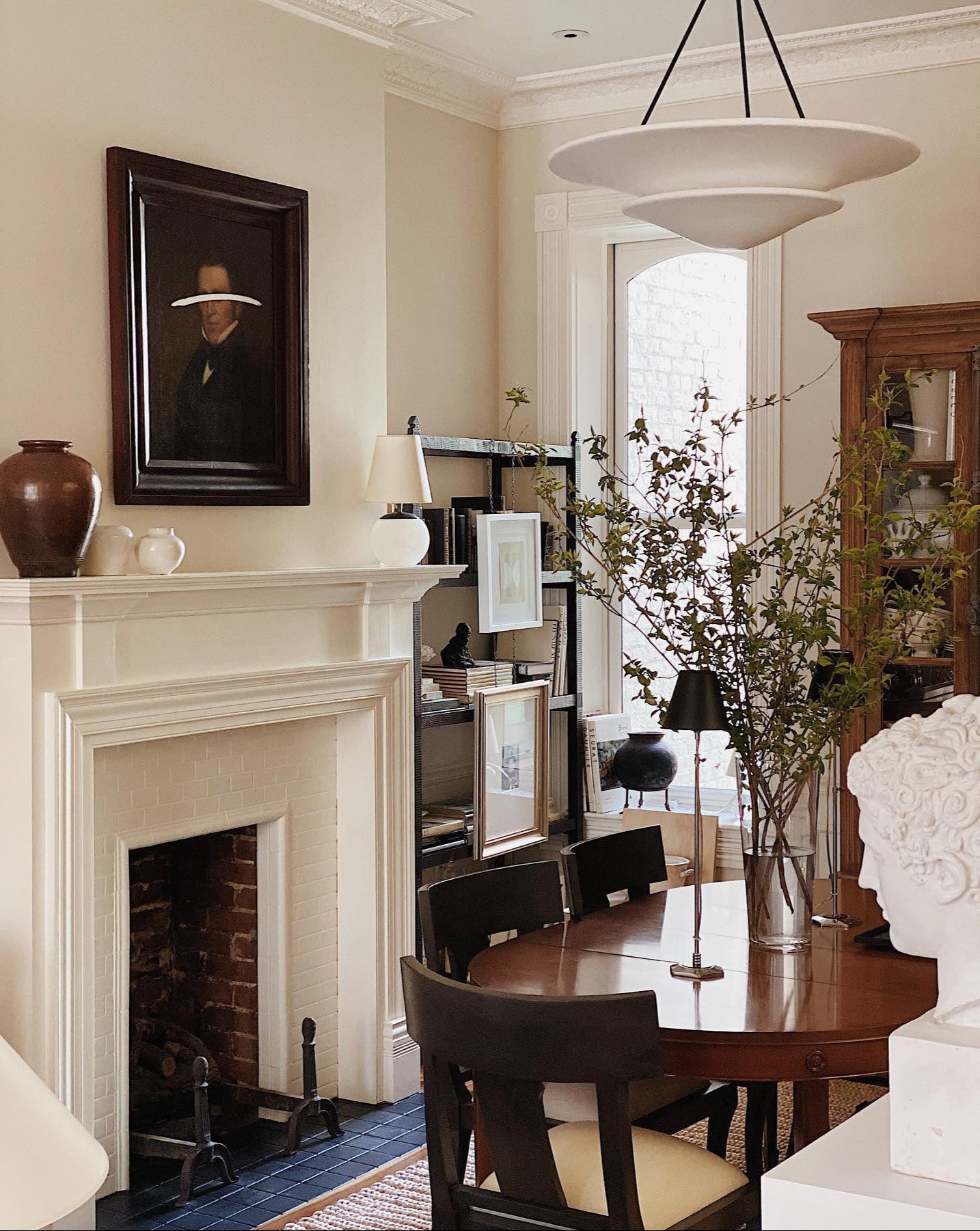 Living room with fireplace, dining table, and decor
